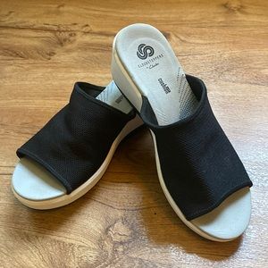 Black and white wedge sandals.